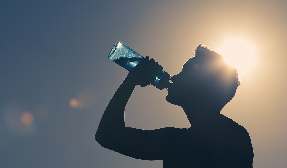 man drinking water