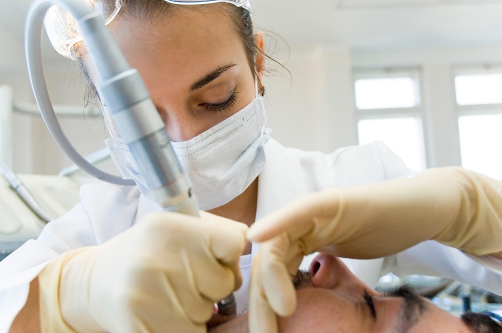 dentist performing sedation dental treatment