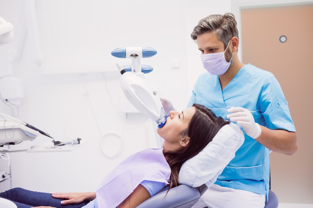 dentist performing dental cleaning